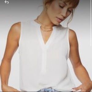 White/ cream sleeveless blouse